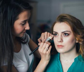 woman getting a makeup